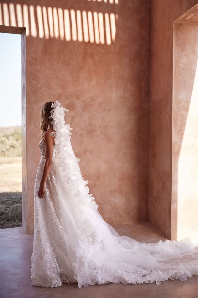 Romantic floor-length tulle veil with handcrafted 3D flower tulle petals along the edges.
