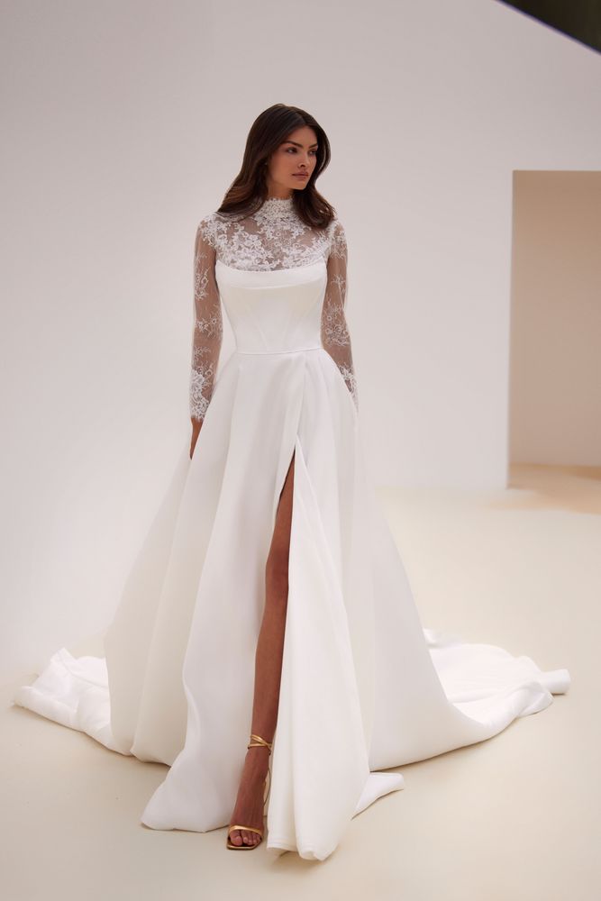 Opulent combination of a long-sleeved lace turtleneck mini gown, a satin boned corset with a closed-button back, and a chic volumetric satin skirt. Comes with a body combination in nude color.
